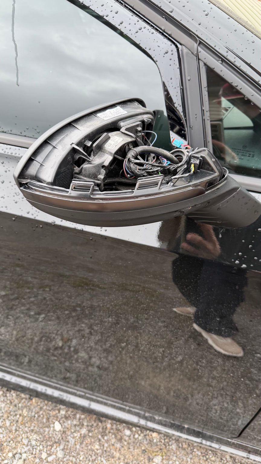 Installation view of a sequential mirror turn signal on a Volkswagen Golf MK8