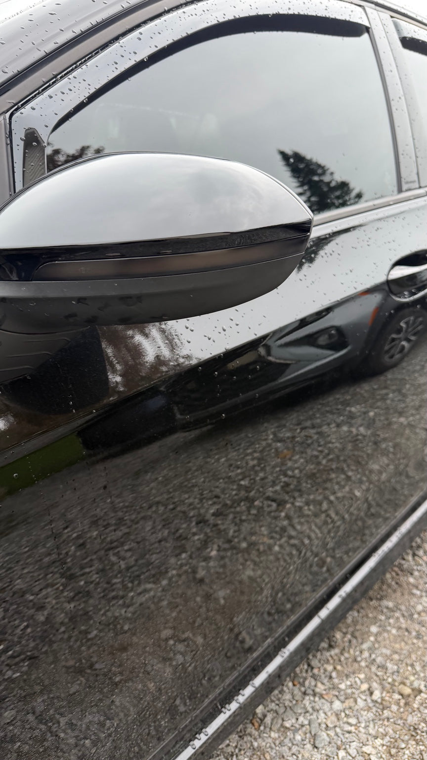 Smoked sequential mirror turn signal installed on a Volkswagen Golf MK8